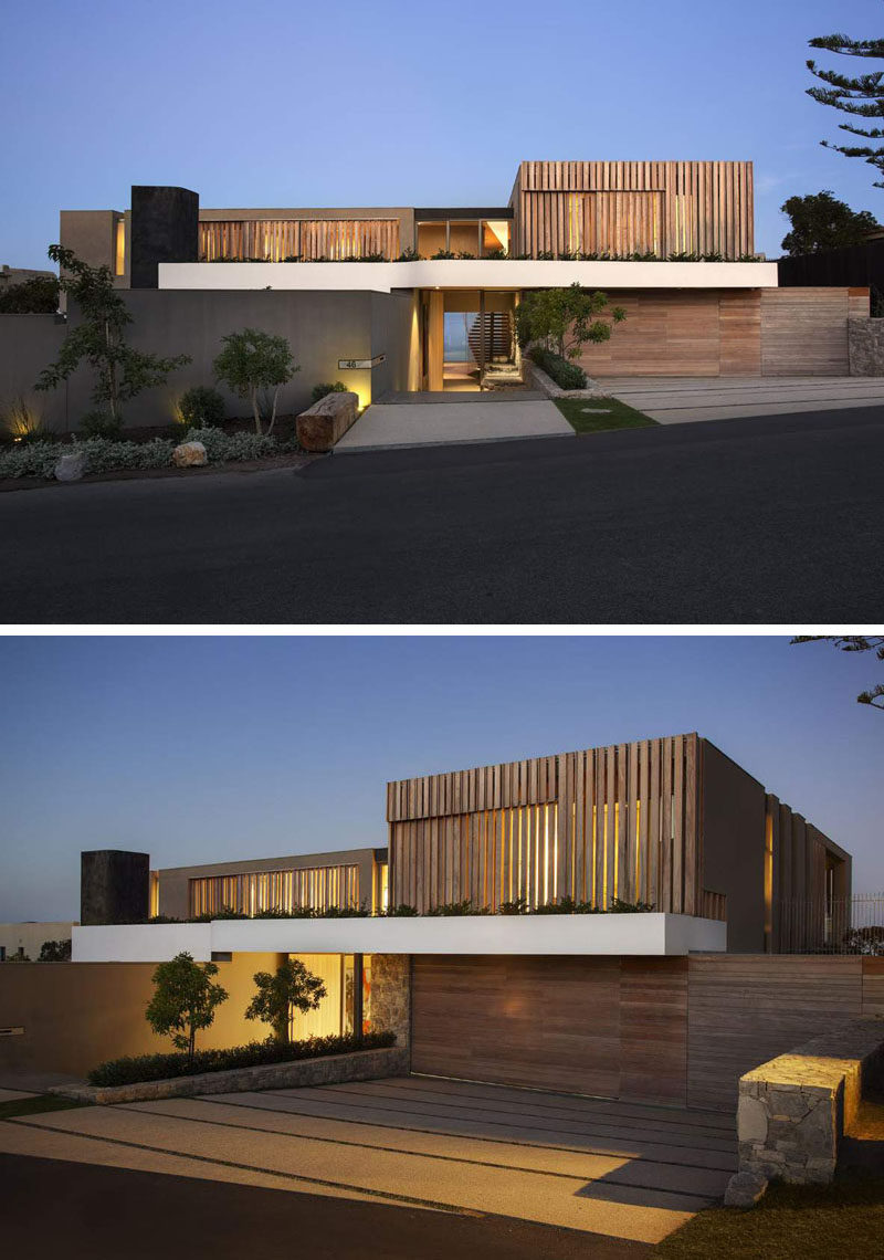 From the street this house seems unassuming, with touches of wood, white and gray mixed in with the surrounding greenery, making for some nice curb appeal.