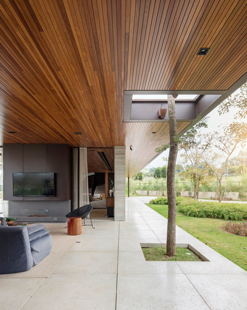 A small section of the floor, ceiling and roof in this house have been removed to allow a tree to grow.