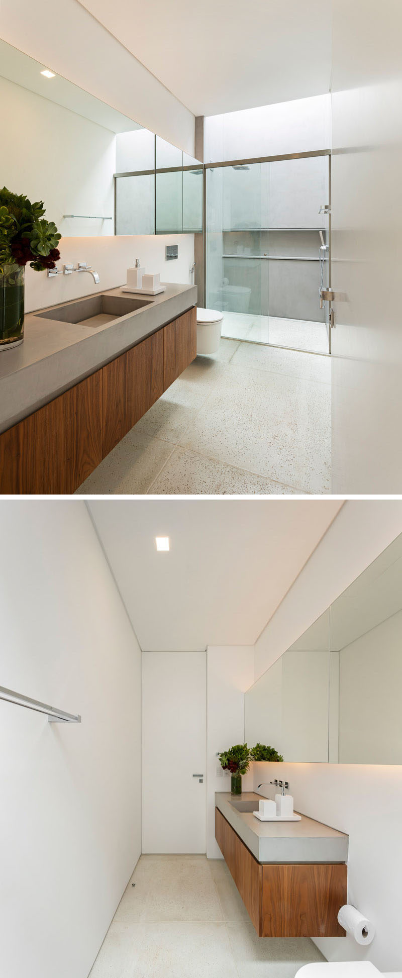 In this ensuite bathroom, there's a vanity with a single sink, and a walk-in shower with lots of light from a skylight.