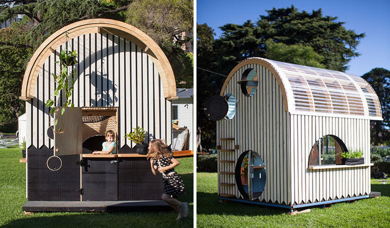 This modern playhouse (or cubbyhouse) has decorative siding and a curved roof with windows. Inside, there's bench seating, storage and loft with a net for relaxing.