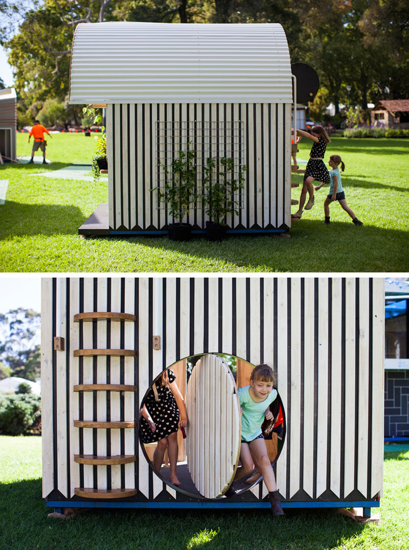 This modern playhouse (or cubbyhouse) has decorative siding and a curved roof with windows. Inside, there's bench seating, storage and loft with a net for relaxing.