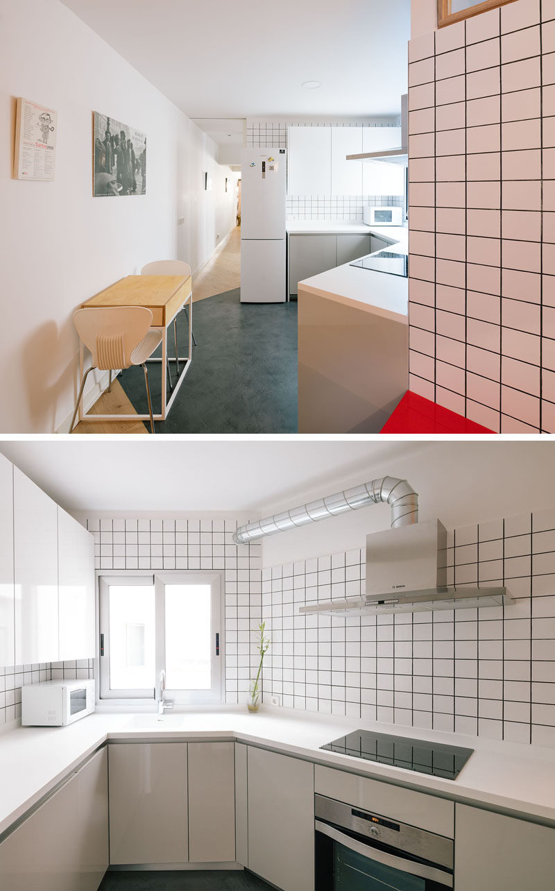 Gray grout and square white tiles have been used to give this kitchen a graphic element.