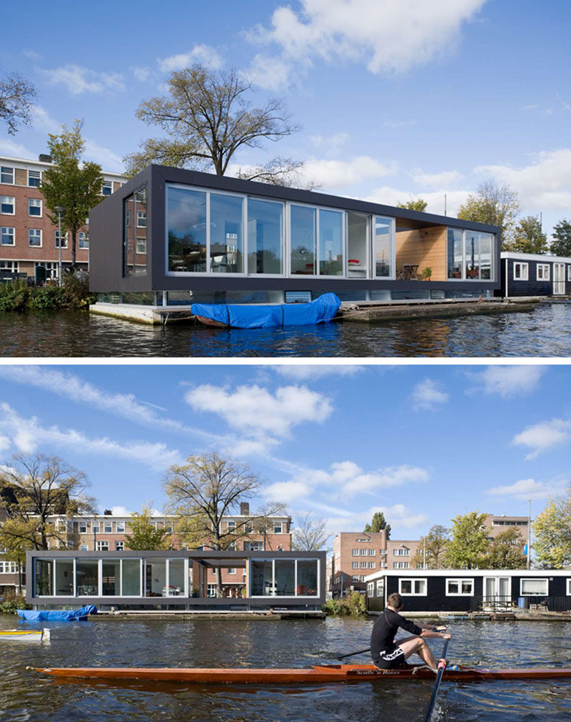 11 Awesome Examples Of Modern House Boats // Large floor to ceiling windows and a large open area provide this house boat with lots of natural light and uninterrupted views of the river outside.