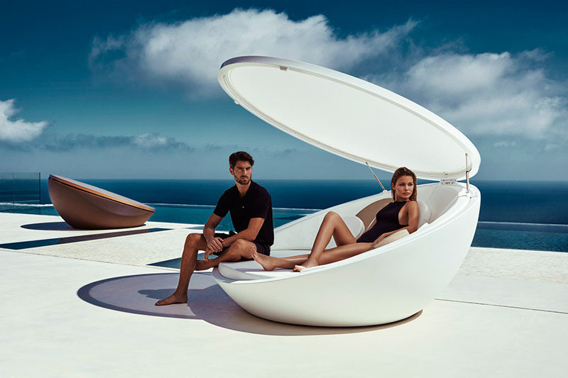 12 Outdoor Furniture Designs That Add A Sculptural Element To Your Backyard // Inspired by a shell, this daybed has a swivel feature so you spin around and take in everything around you. This lid also helps to provide shade on a hot day.