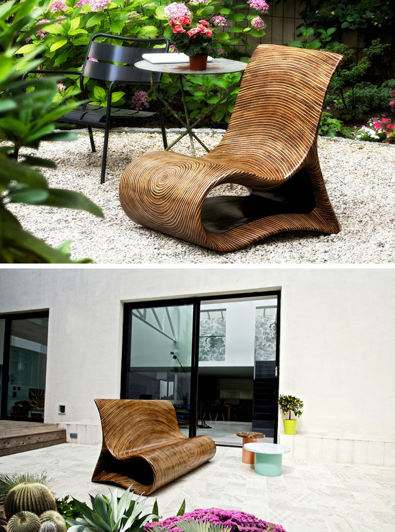 12 Outdoor Furniture Designs That Add A Sculptural Element To Your Backyard // An intricate wood lamination technique used on laminated coco and rattan is what gives this unique chair its uncommon shape and form. The resin finish makes it suitable for both indoor and outdoor enjoyment.