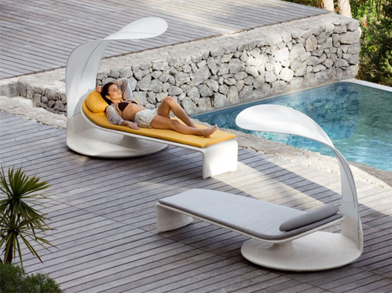 12 Outdoor Furniture Designs That Add A Sculptural Element To Your Backyard // Drift off to sleep in this sun lounge that has a shade cover that can swivel, allowing you enhance your sun-worshiping moments.