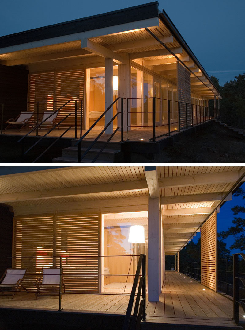 17 Inspiring Examples Where Exterior Uplighting Has Been Used To Show Off A House //The small lights along the deck of this cottage brighten the exterior, and make entertaining into the evening easy and fun. 