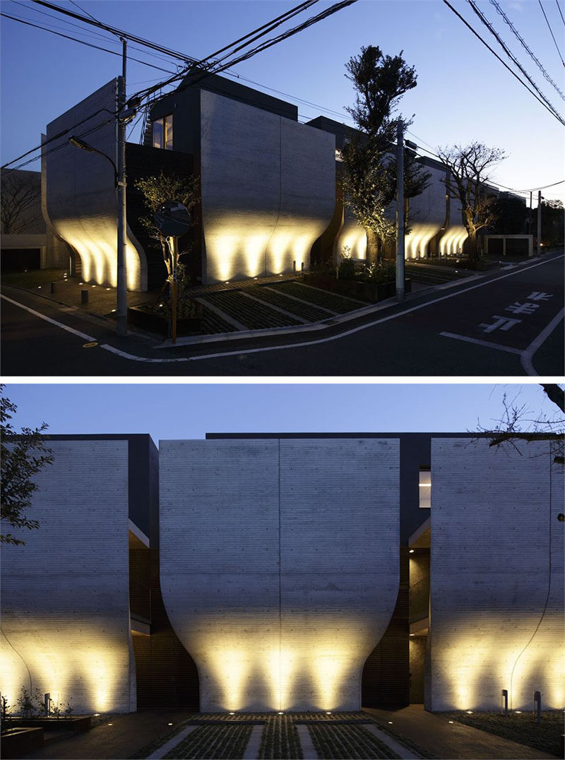 17 Inspiring Examples Where Exterior Uplighting Has Been Used To Show Off A House // Lights beneath the curved walls of this home emphasize the unique outer design of the home and brighten the entire exterior.