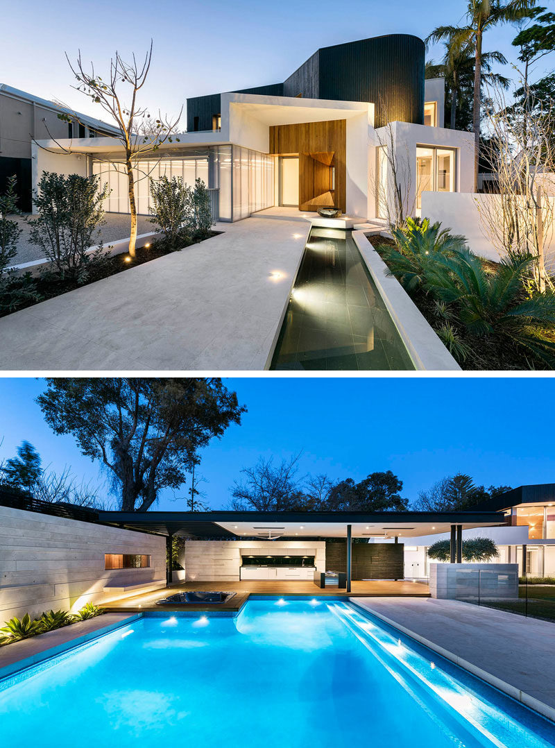 17 Inspiring Examples Where Exterior Uplighting Has Been Used To Show Off A House // Lights placed throughout both the front and back yards of this home, illuminate pathways and create dramatic lighting around the plants and trees.