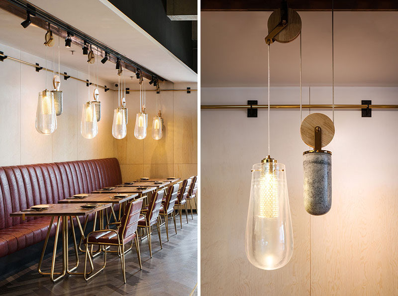 This Restaurant Is Filled With Pendant Lighting On A Pulley System