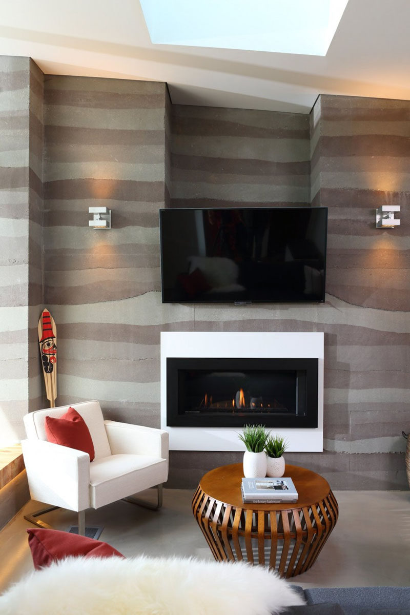 The different layers of rammed earth create a lined design for the wall.