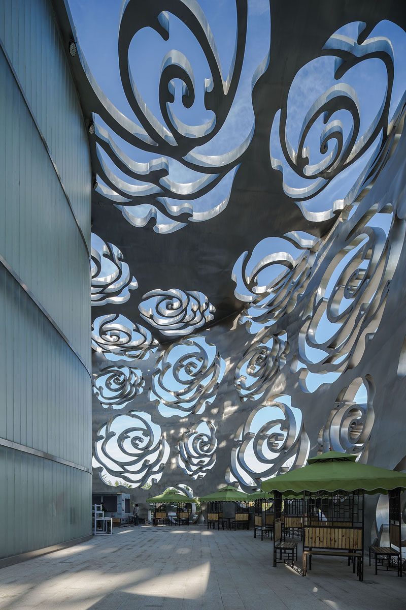 The world's first Rose Museum has opened in Beijing, China, and it's covered by a stainless steel facade that measures in at 984 ft (300m) long and 55ft (17m) high and is perforated by a rose-shaped pattern.