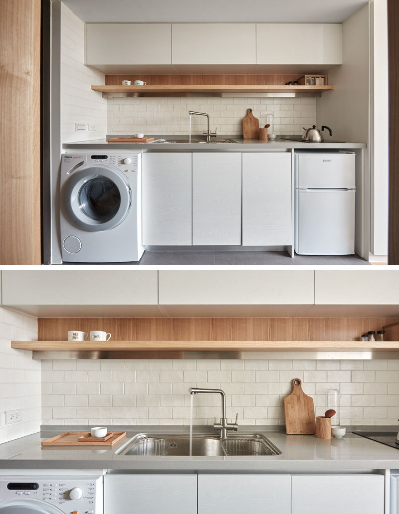 The kitchen in this tiny apartment, has a small cooktop, mini-fridge, washer/dryer and some storage.