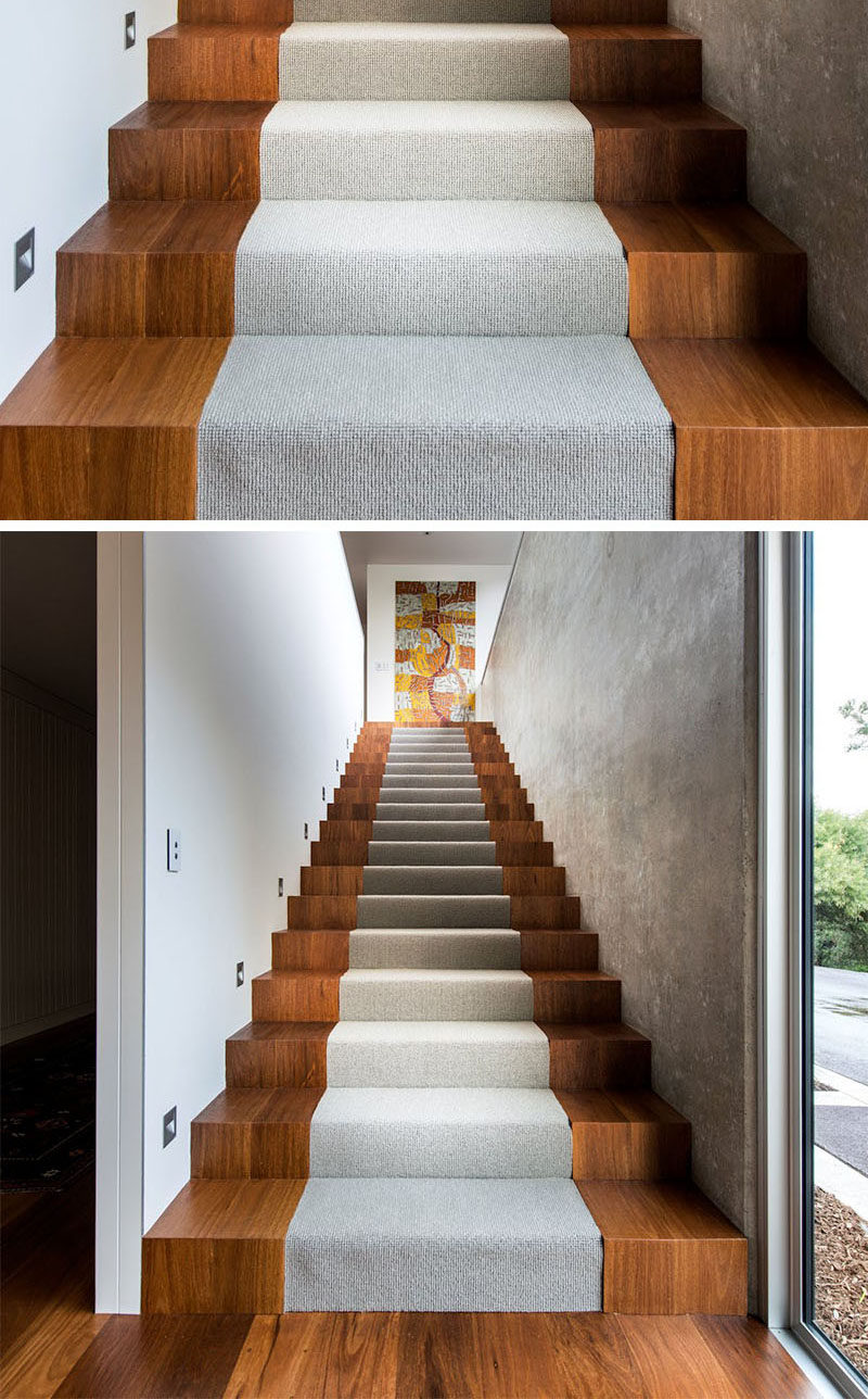 18 Examples Of Stair Details To Inspire You // These wooden stairs are interrupted by a center section with light gray carpet.