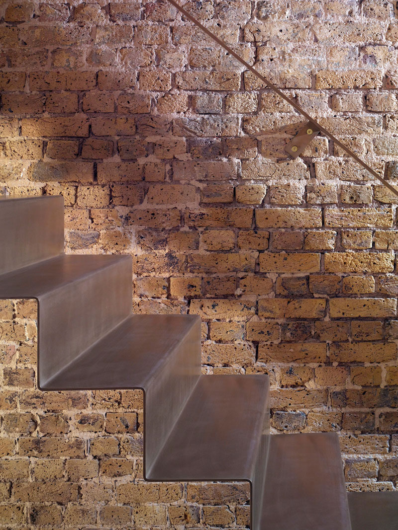 As part of the refurbishment of an apartment in Hackney, North London, Bell Phillips Architects designed minimalist stairs made from 6mm thick folded steel.