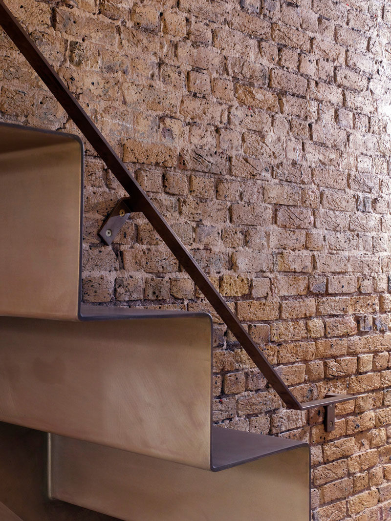 As part of the refurbishment of an apartment in Hackney, North London, Bell Phillips Architects designed minimalist stairs made from 6mm thick folded steel.