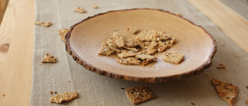 9 Ideas For Including Tree Stumps In Your Home Decor // This bowl made from a thin slice of a tree trunk can be used to hold decorative things or can be used as a serving plate for snacks like chips or crackers.