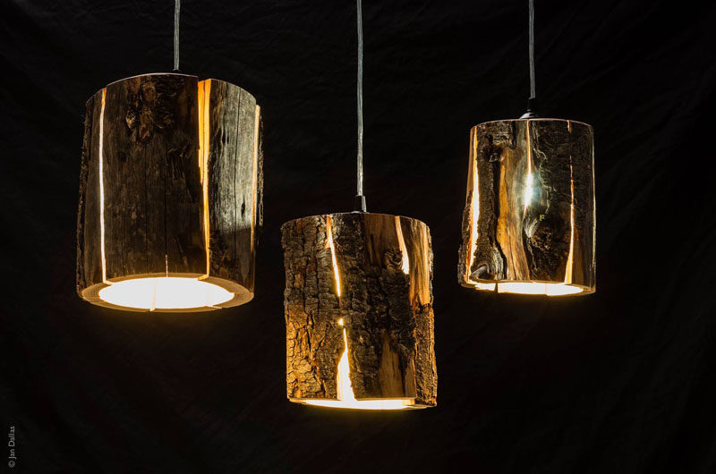 9 Ideas For Including Tree Stumps In Your Home Decor // Made by artist Duncan Meerding, these cracked log pendant lamps embrace the naturally occurring cracks in the wood and use them to emit light from within the stump.