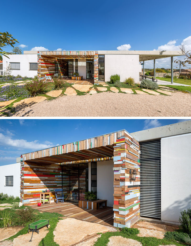 Often white stucco houses are just that, white stucco, but with this house, the white stucco walls have been broken up by an artistic yet function scrap wood element, that makes a fun artistic statement.