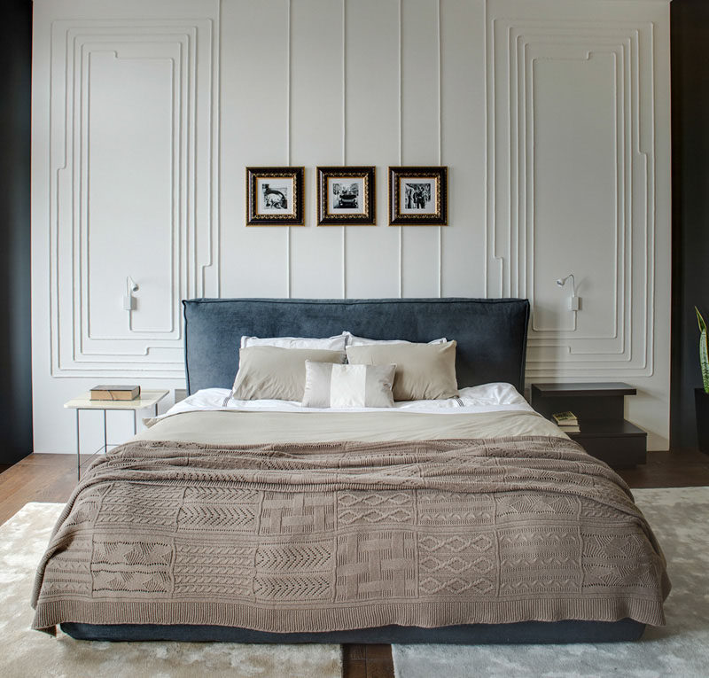 Electrical cords create wall art in a modern bedroom.