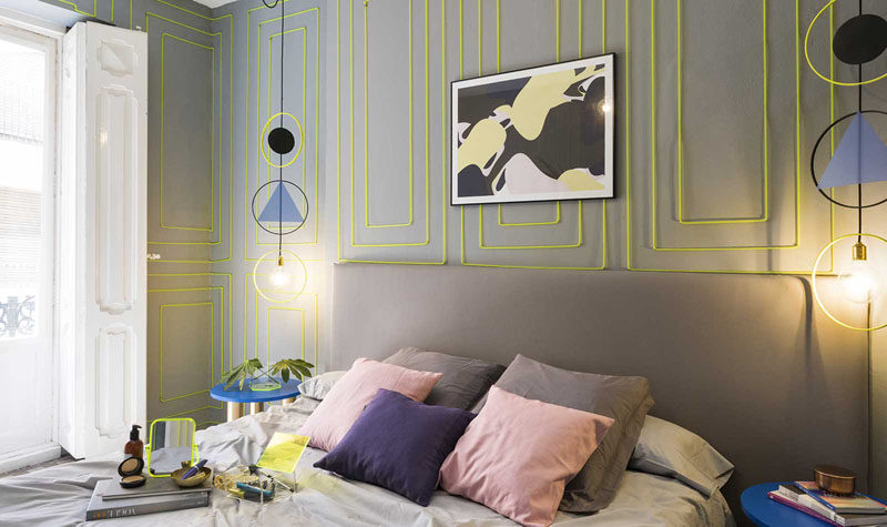 Wall Decor Inspiration - Bold Graphics Cover The Walls Of This Spanish Hostel // Green rectangular neon art livens up the walls of this mostly grey room.