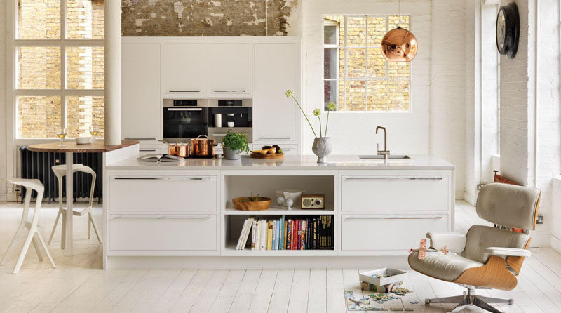 9 Examples Of Kitchens With Built-In Coffee Machines // The built-in stainless steel coffee maker in this kitchen matches the other appliances perfectly and contributes to the overall modern feel of the loft.