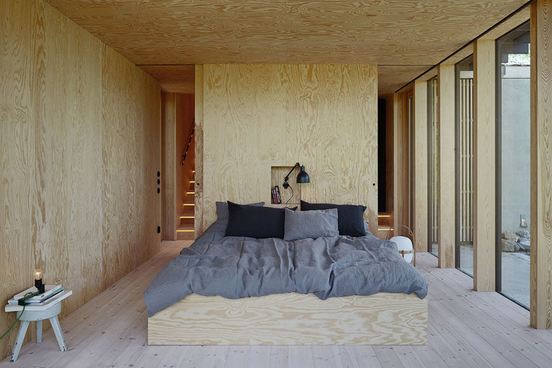 HEADBOARD DESIGN IDEA - Include A Built-In Shelf // This plywood headboard features a small central built-in shelf that's just the right size for a lamp and a few books.