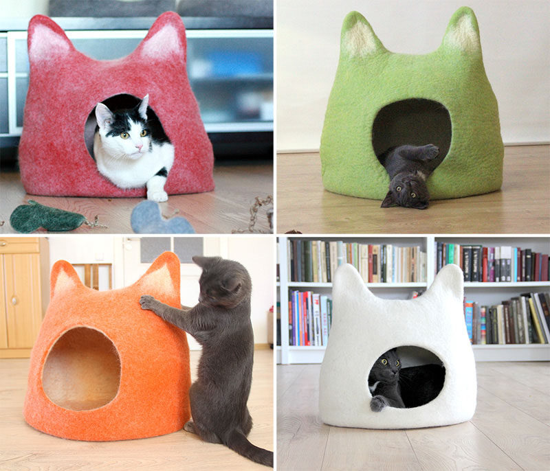 11 Cat Caves That Prove Cat Beds Can Be Stylish // Colorful felted beds in the shape of cat heads provide a cozy spot to curl up in or a convenient place to scratch away at.