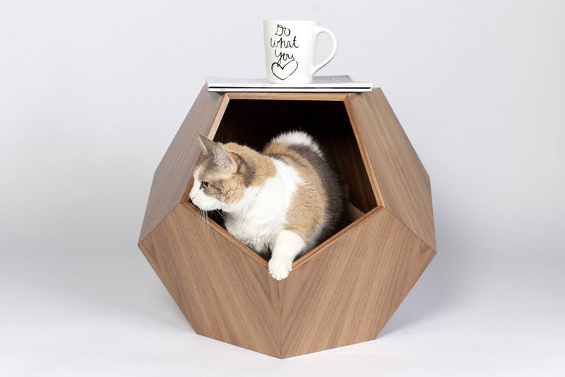 11 Cat Caves That Prove Cat Beds Can Be Stylish // This wooden geometric cat bed can be used as small side table in your living room and keeps your cat near by while you watch TV.