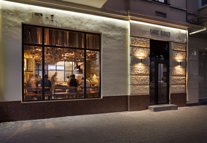 This contemporary restaurant has an artistic ceiling detail made from hundreds of wood veneer sheets.