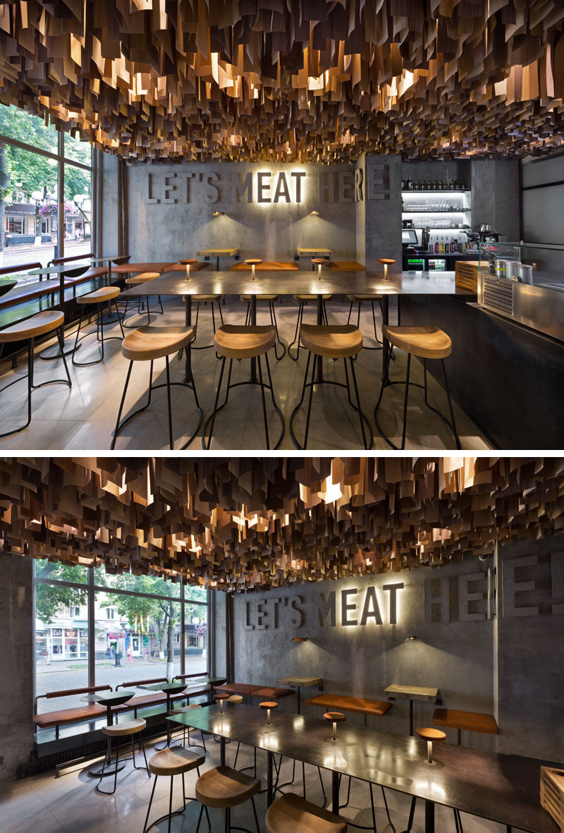 This contemporary restaurant has an artistic ceiling detail made from hundreds of wood veneer sheets.
