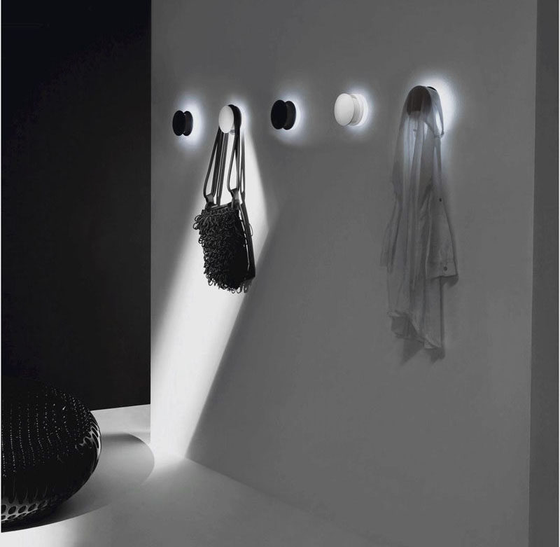 11 Creative Coat Hooks To Keep Your Clothes And Bags Off The Floor // White LED lights attached to the back of these coat hooks illuminate your hallway and cast a bright glow around your bags and coats. #CoatHooks #WallHook #ModernWallHook