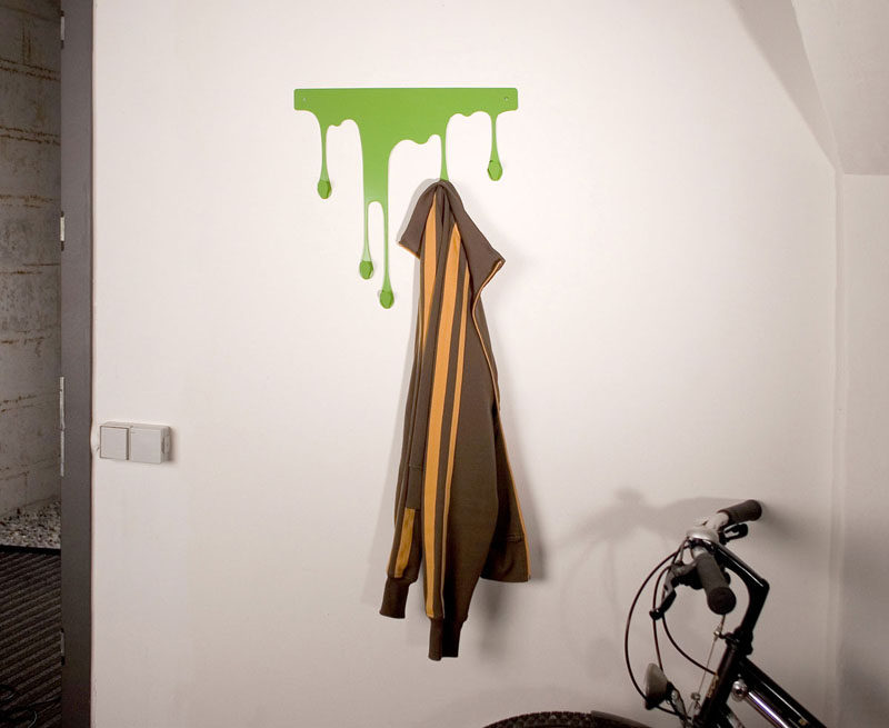 11 Creative Coat Hooks To Keep Your Clothes And Bags Off The Floor // This colorful dripping hook system comes in various sizes and colors allowing it to be used in a variety of setting, including entry ways and kitchens. #CoatHooks #WallHook #ModernWallHook