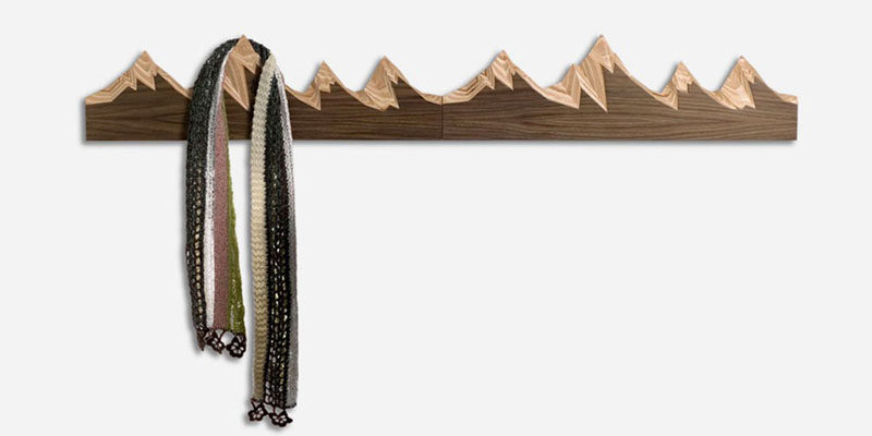 11 Creative Coat Hooks To Keep Your Clothes And Bags Off The Floor // These coat hooks, inspired by snow-capped mountains, add a bit of nature to your home and provide a convenient place to hang your things as you walk into the house. #CoatHooks #WallHook #ModernWallHook