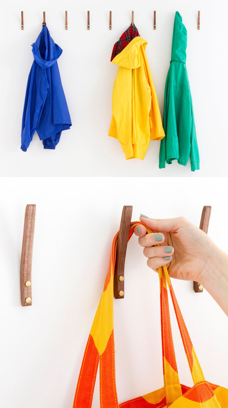 11 Creative Coat Hooks To Keep Your Clothes And Bags Off The Floor // This simple steam bent wooden hook adds a touch of warmth to your walls and they are strong enough to hang jackets, backpacks, shirts and scarves. #CoatHooks #WallHook #ModernWallHook