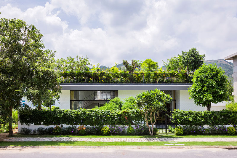 When the owners of this house requested a house with a large garden, the architects responded by designing a house with a terraced roof, filled with plants.