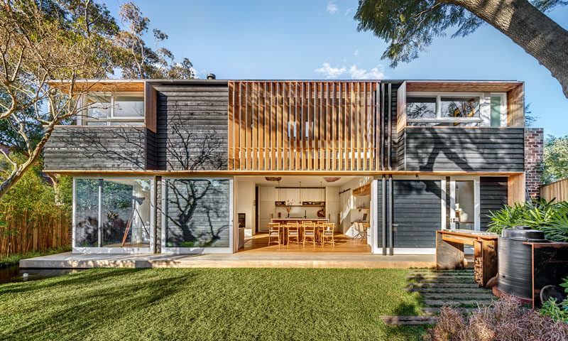 Using a palette of recycled brick, brass, internal timber lining boards, solid timber, and rough sawn tactile cladding reminiscent of shou sugi ban, this Australian home has a contemporary and warm feeling to it.