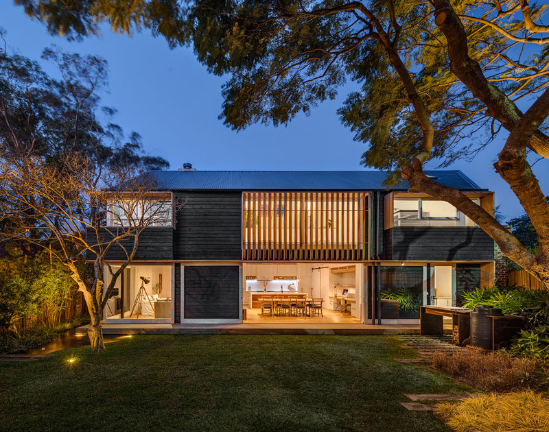 This Australian home has a palette of recycled brick, brass, internal timber lining boards, solid timber, and rough sawn tactile cladding reminiscent of shou sugi ban (burnt wood siding).