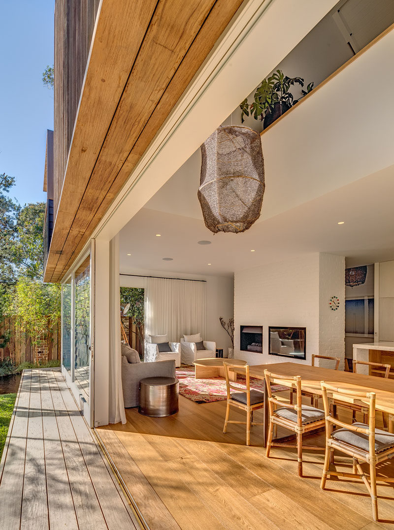 This Australian home has sliding doors that open the dining and living area to the backyard for indoor/outdoor living.