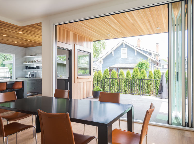 An accordion glass wall and separate side door, connect the back porch to both the kitchen and dining room. The back porch is large enough to be set up as an outdoor dining room for ten.