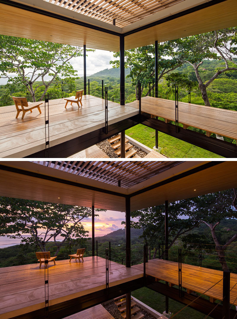 From the second level of this home, you are able to see the treetops of the forest and views of the water.