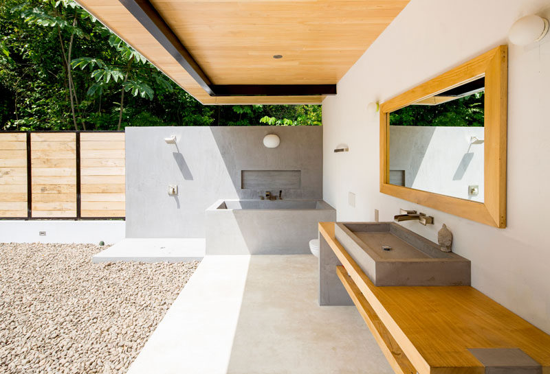 This bathroom in a house in Costa Rica, is wide open to the elements, and has all of the furniture, bath and shower built-in.