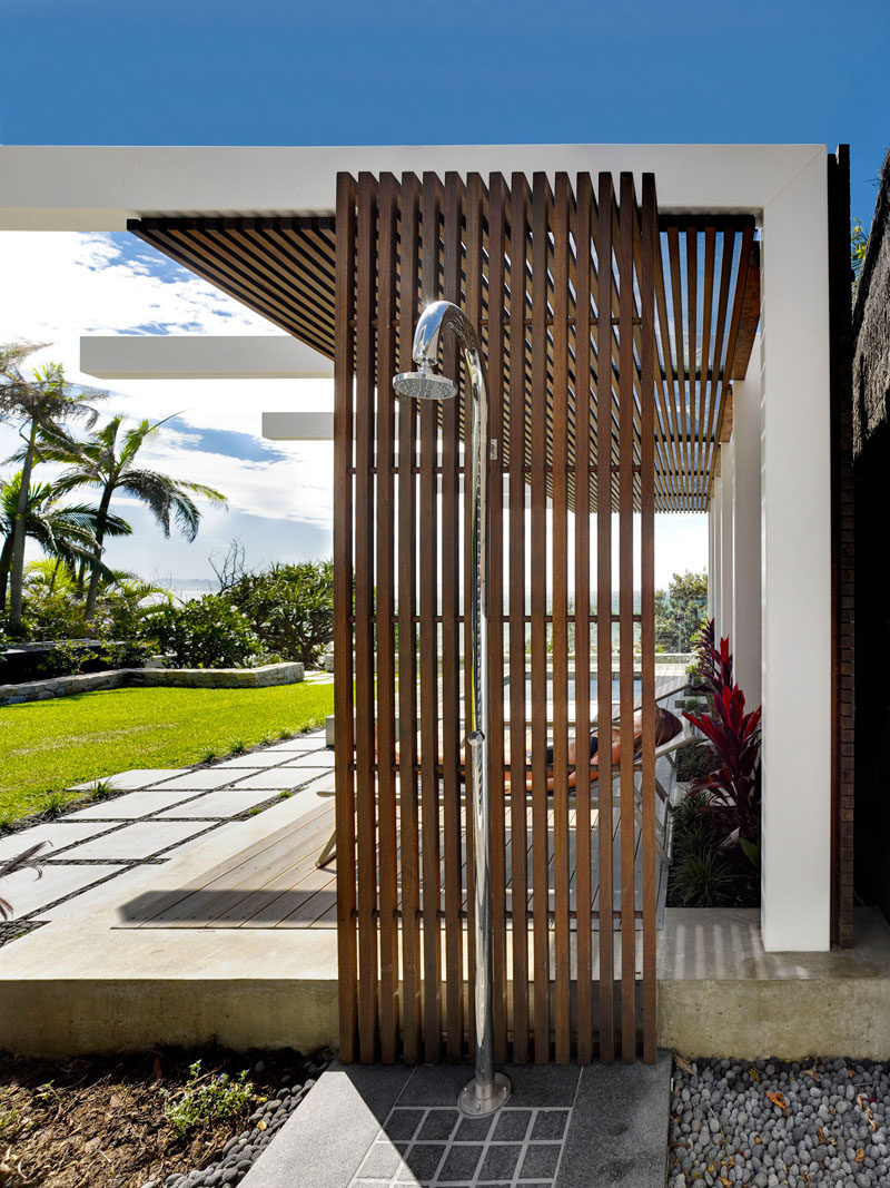 This wood and steel outdoor shower is ideal for rinsing off after a day at the beach.