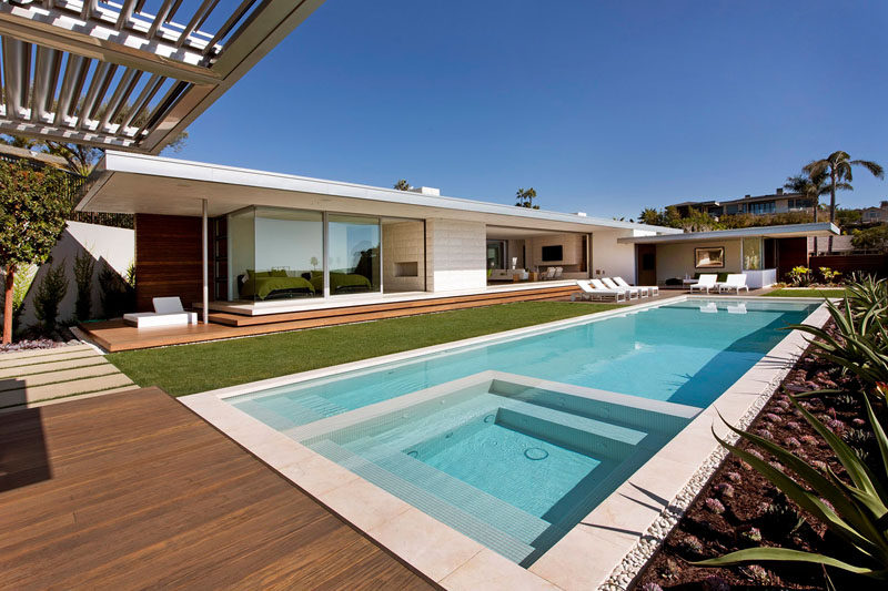 Designed for a couple and their two sons, this home in Laguna Beach, California, makes the most of the beautiful weather by having most spaces open up to the backyard and swimming pool.