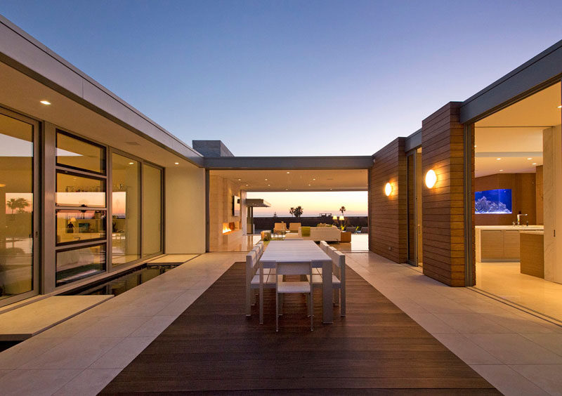 A home office, guest and children’s bedrooms open onto the protected central courtyard which features an outdoor kitchen, dining area and koi pond.