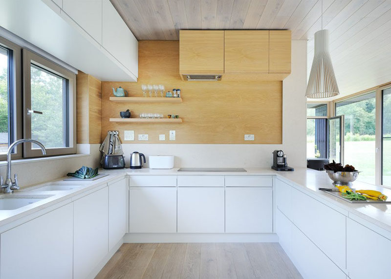 This kitchen is in a U-shape allowing for plenty of counter space, and open shelving is perfect for displaying various kitchen items.