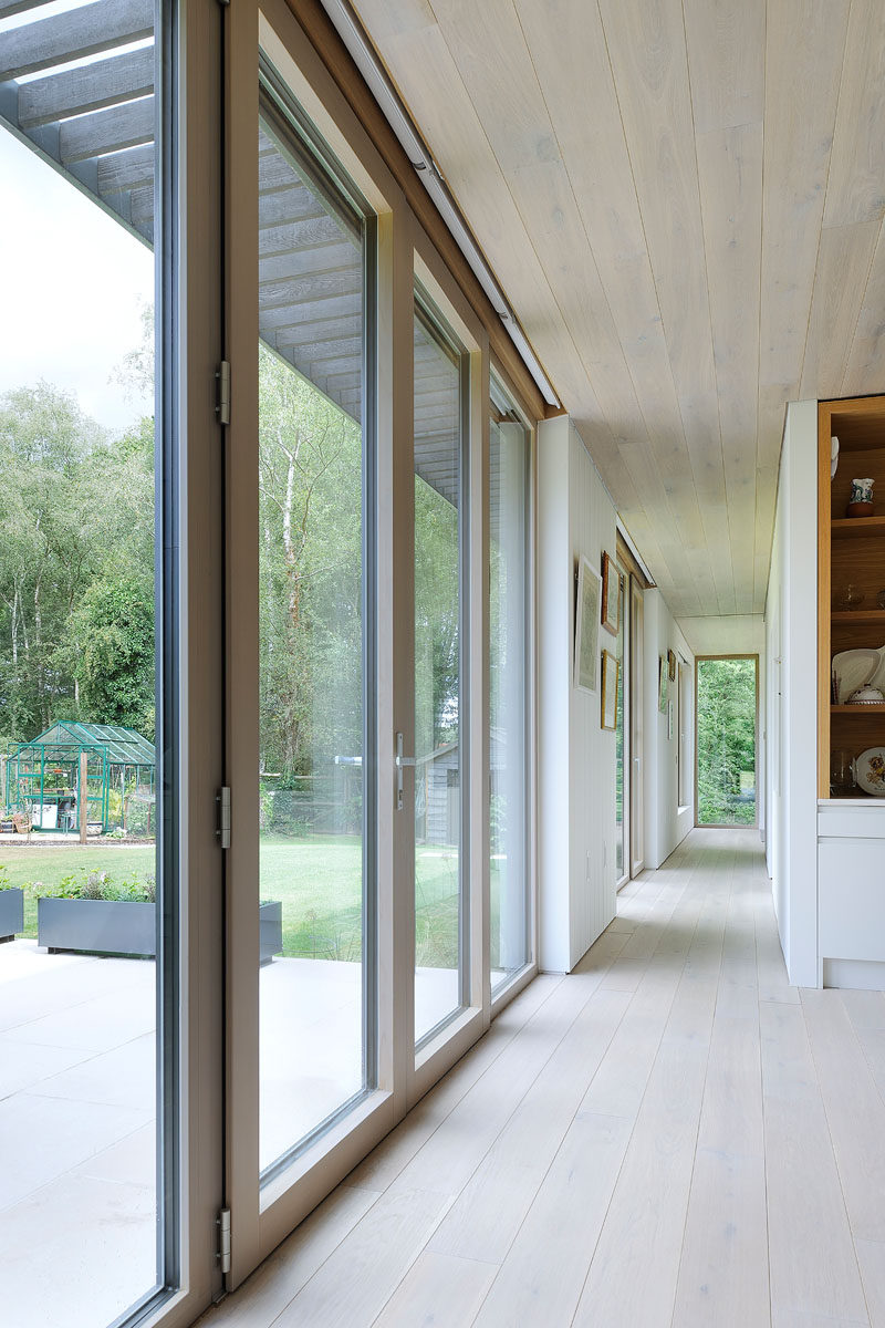 The floor-to-ceiling windows provide an abundance of light in this hallway, that leads to the bedroom.