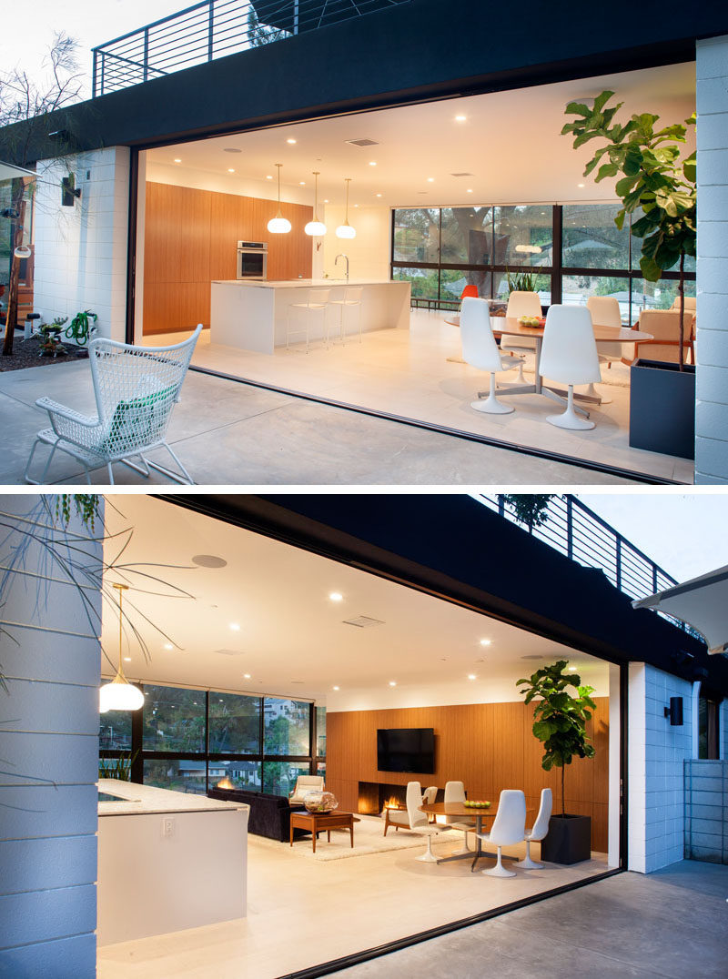 The main floor of this home is open to the outdoor area to let the light to flood the space, and to create an indoor/outdoor living environment.