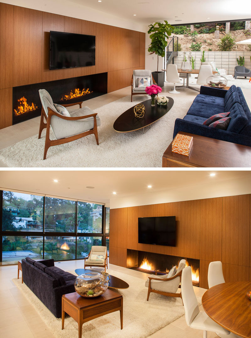 Inside this home there's an open floor plan, with the living room focused on the television and fireplace.