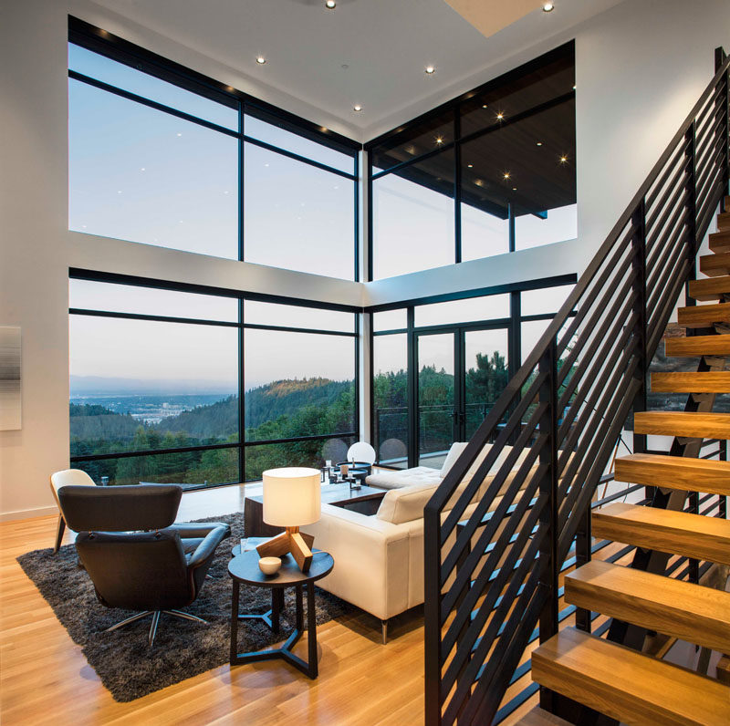 Large windows provide an abundance of natural light to this living room, making it feel even more open and airy than it already is.